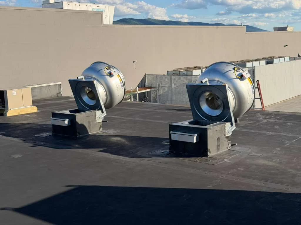 Commercial exhaust fans opened for preventive maintenance inspection