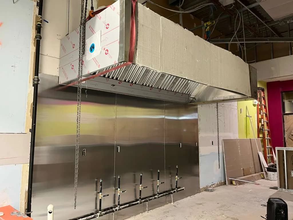CaptiveAire commercial hood being installed in Maryland restaurant kitchen