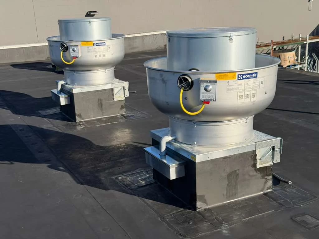 Commercial rooftop upblast exhaust fans requiring repair and maintenance