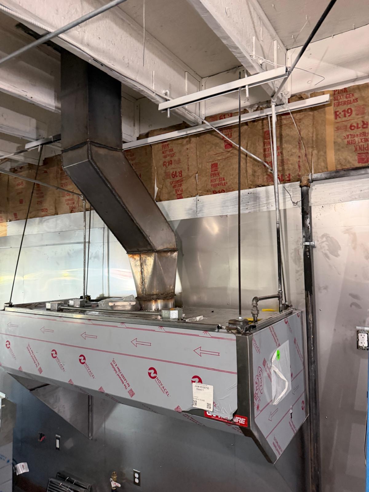 Commercial kitchen hood installation in progress